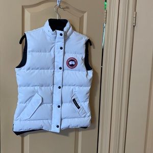 Great for spring and fall - bright white Canada Goose vest in great condition.